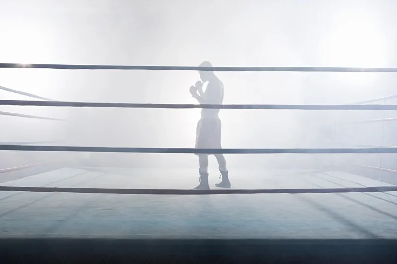 Cảm nhận sức nóng trận đấu qua background boxing võ đài đầy khí thế