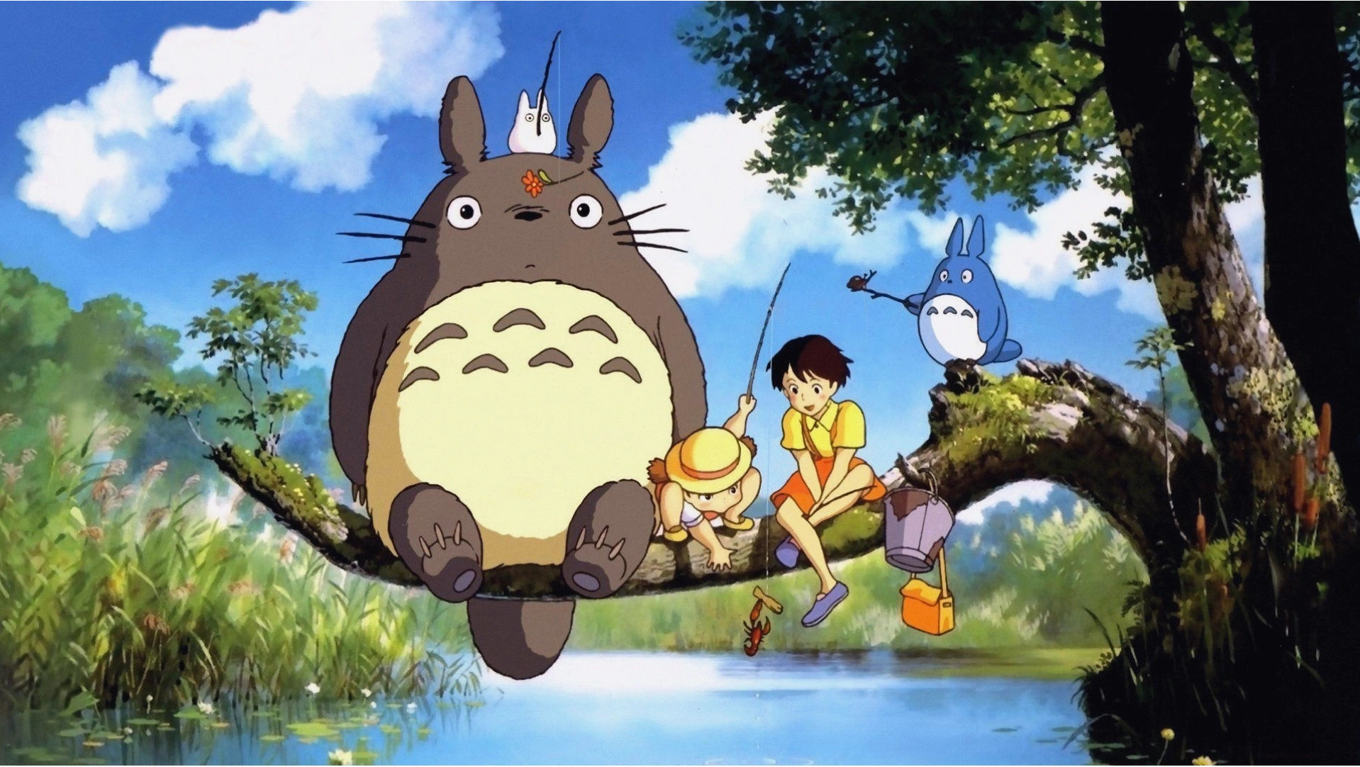 Hình nền máy tính Totoro đang ngồi trên một chiếc lá khổng lồ